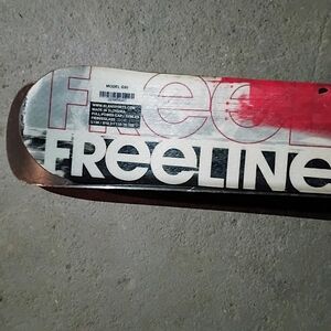 Freeline Skateboard Deck with Red and Black Design